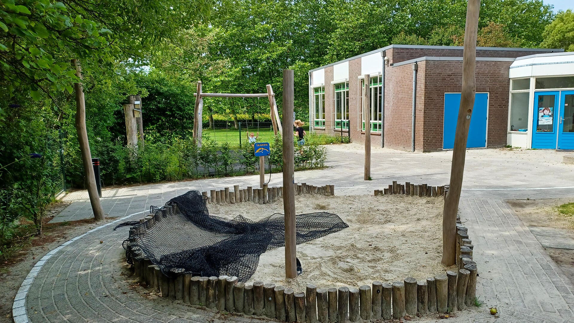 Refurbishment of schoolyard with natural and recycled materials